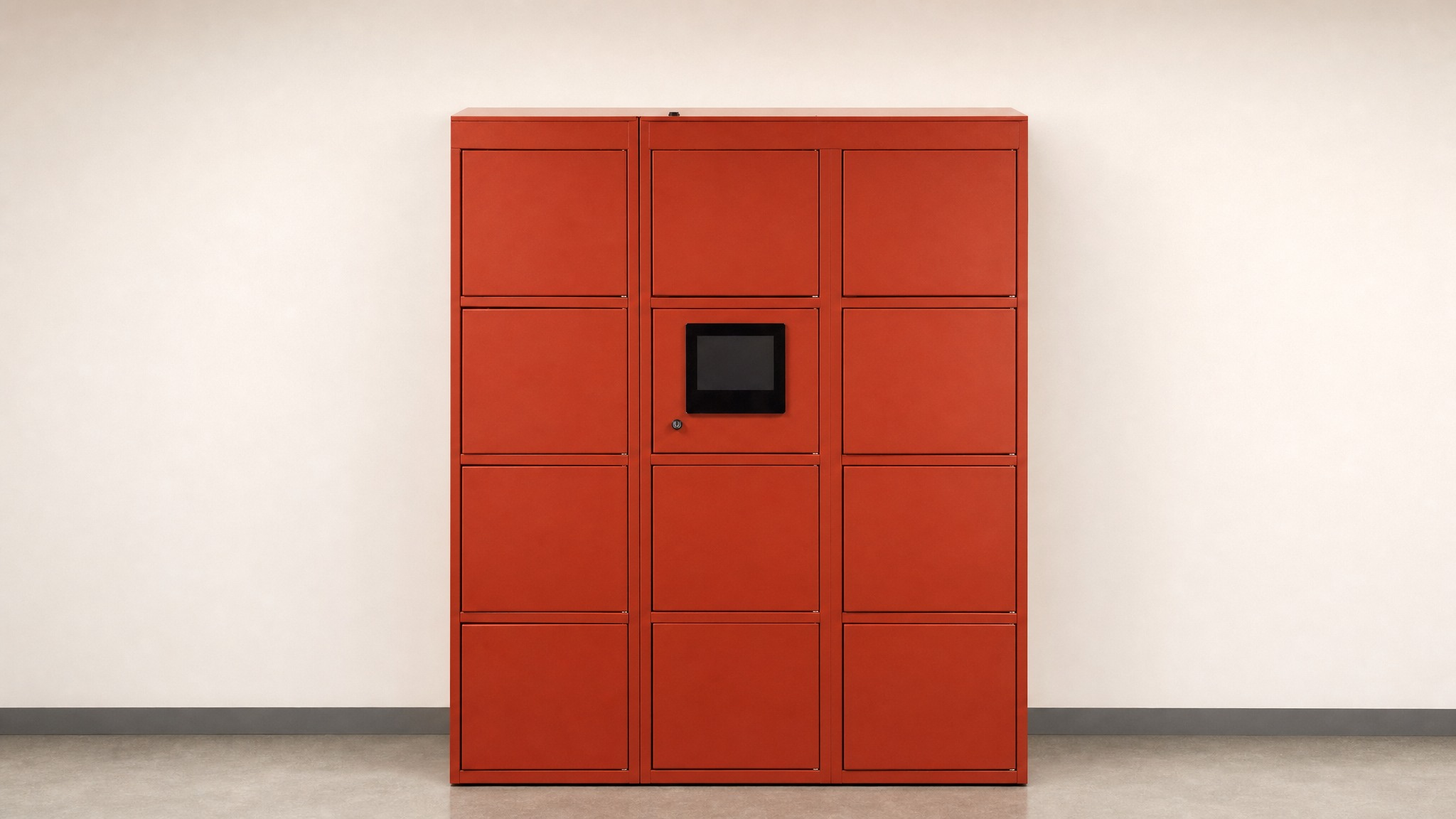 Red locker bank with a central display panel against a light wall.