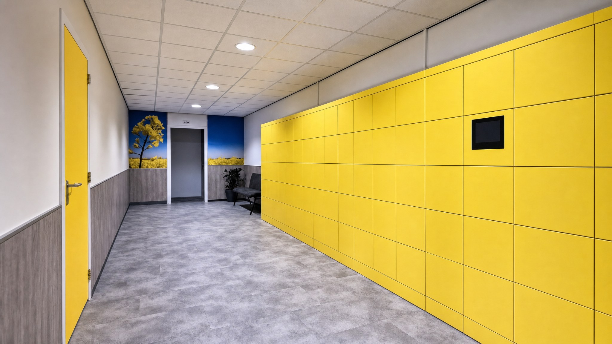 Yellow locker wall with an integrated display in a modern hallway.